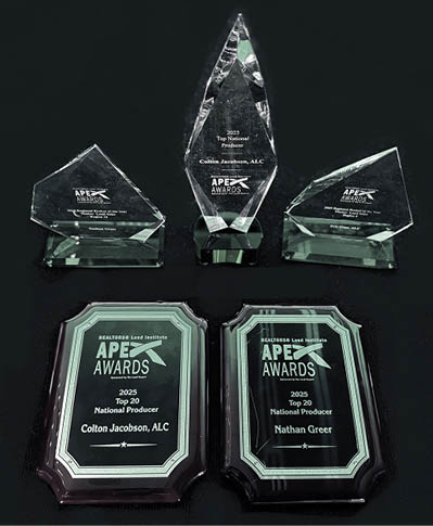 Three awards sit on a table, including one for “Best Paper." AI generated content